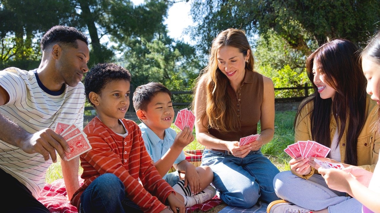 COC Adults and kids playing cards picnic