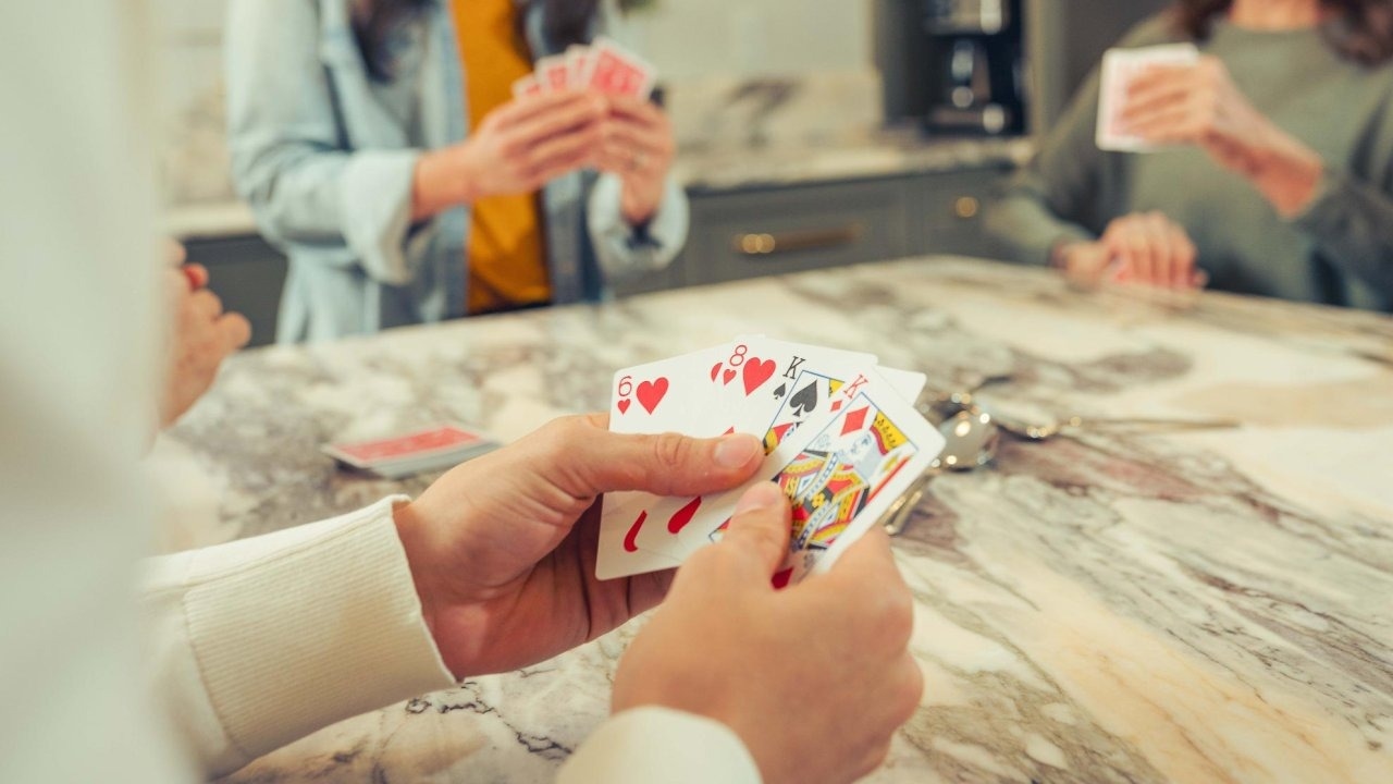 Man holding fanned cards